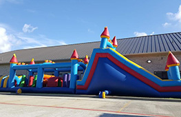 Full inflatable obstacle course rental setup for Houston events