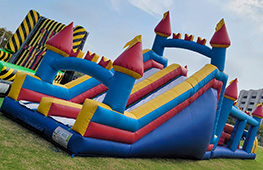 Colorful inflatable obstacle course with climbing and sliding activities