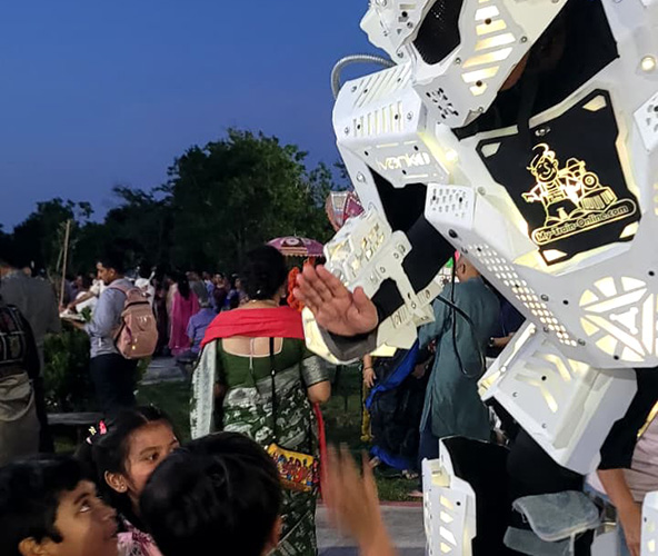 LED party robot entertaining children and families at an outdoor event