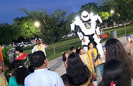 LED party robot rental with lights and entertainment at a Houston event