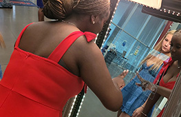 Guest taking photos at a mirror photo booth during a special event